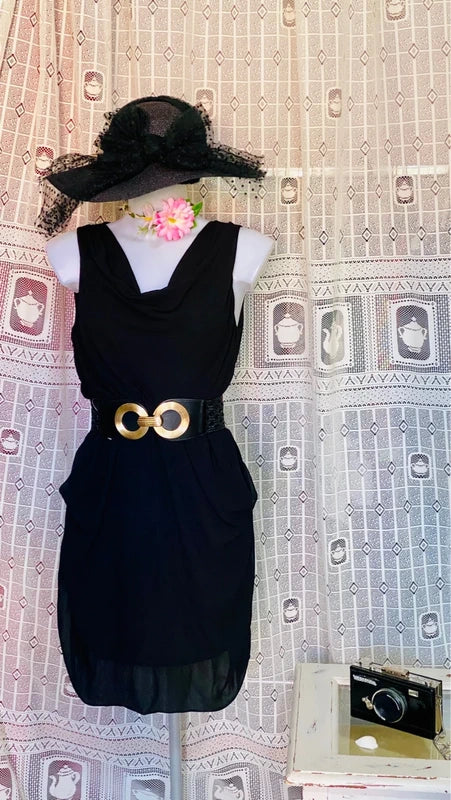 Dress with low neckline and draped skirt