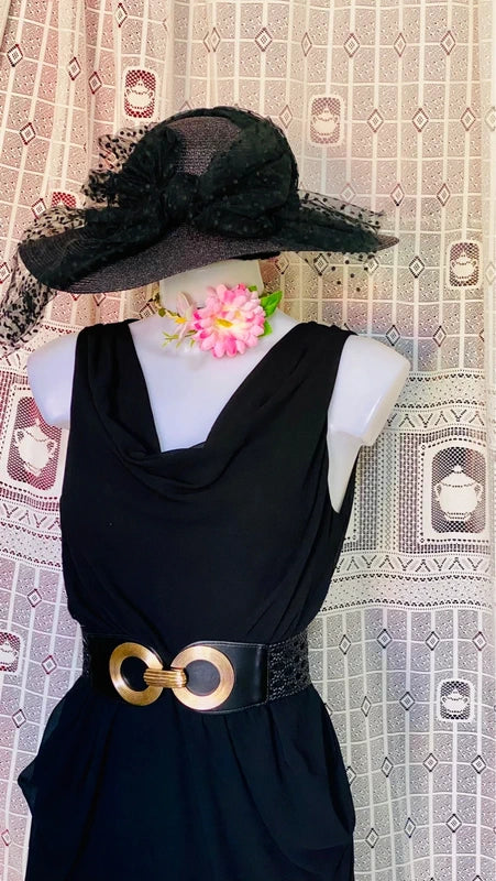 Dress with low neckline and draped skirt