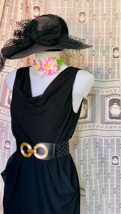 Dress with low neckline and draped skirt