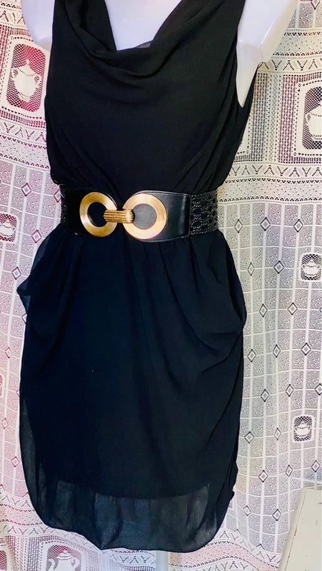 Dress with low neckline and draped skirt