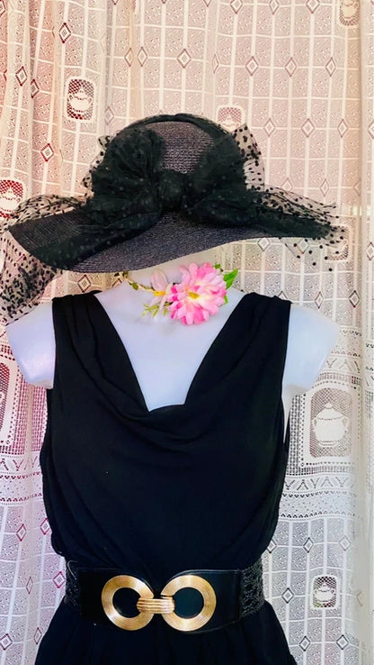 Dress with low neckline and draped skirt