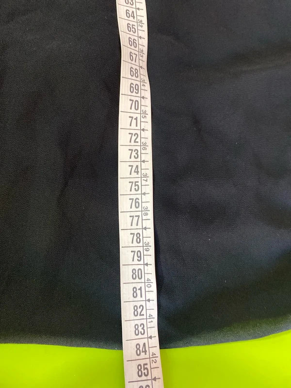 Dress with low neckline and draped skirt