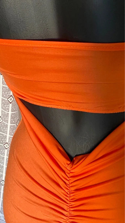 retro Abito lungo retrò donna morani displayed on mannequin with orange color and floral accessories.