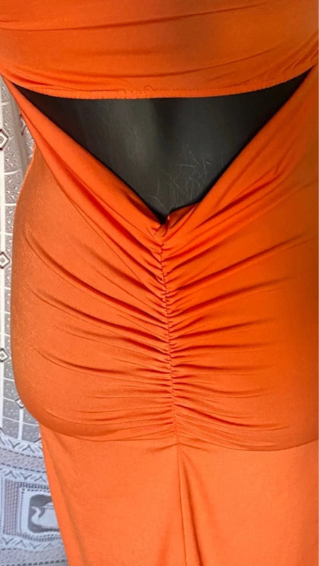 retro Abito lungo retrò donna morani displayed on mannequin with orange color and floral accessories.