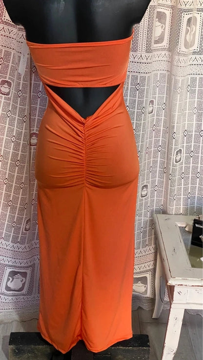 retro Abito lungo retrò donna morani displayed on mannequin with orange color and floral accessories.