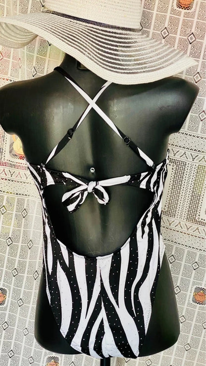 One-piece swimsuit and red skirt