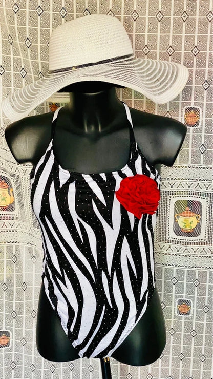 One-piece swimsuit and red skirt