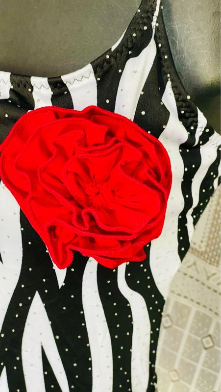 One-piece swimsuit and red skirt