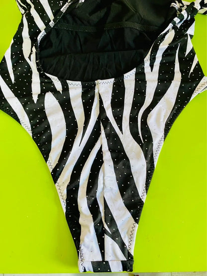 One-piece swimsuit and red skirt