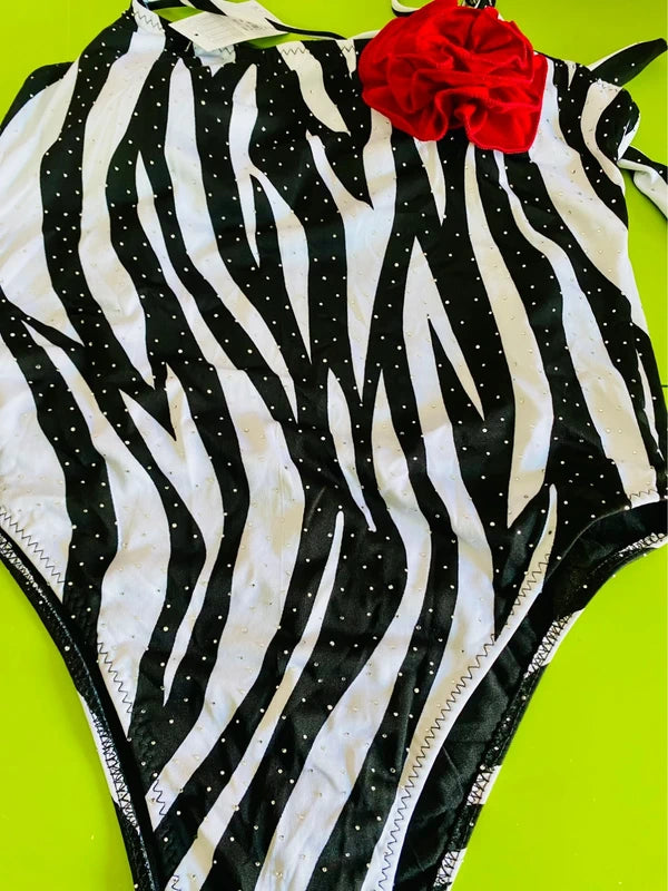 One-piece swimsuit and red skirt