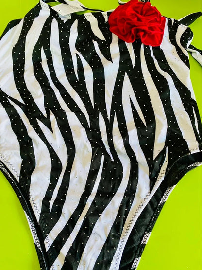 One-piece swimsuit and red skirt