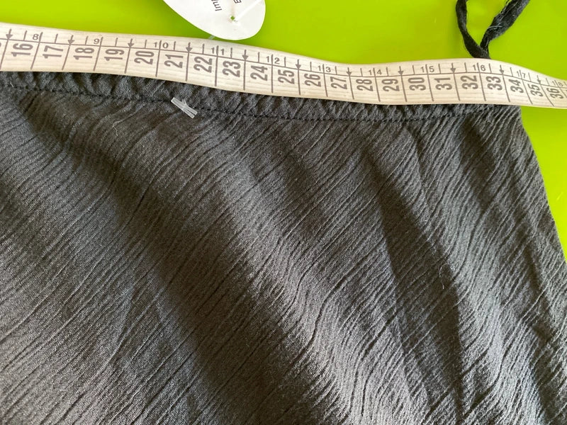 One-piece swimsuit and red skirt