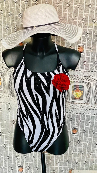 One-piece swimsuit and red skirt