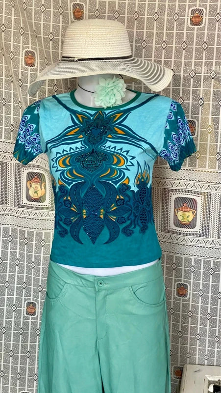 Completo pantalone a palazzo di pelle e top