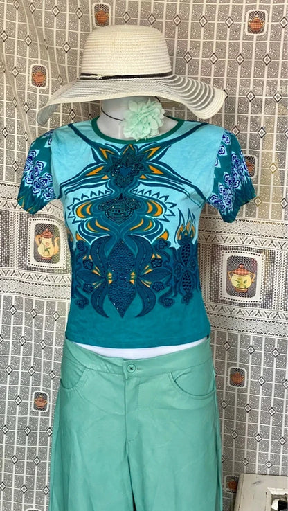 Completo pantalone a palazzo di pelle e top