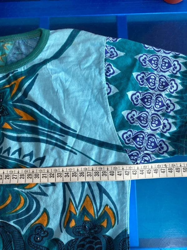 Completo pantalone a palazzo di pelle e top