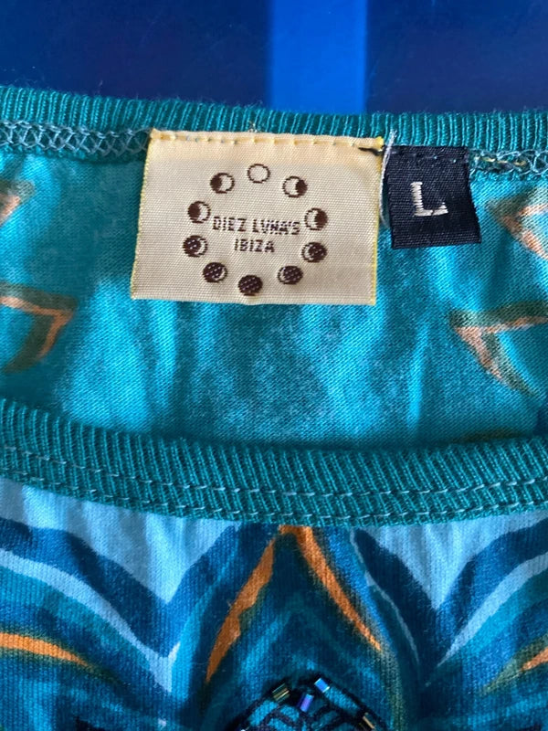 Completo pantalone a palazzo di pelle e top