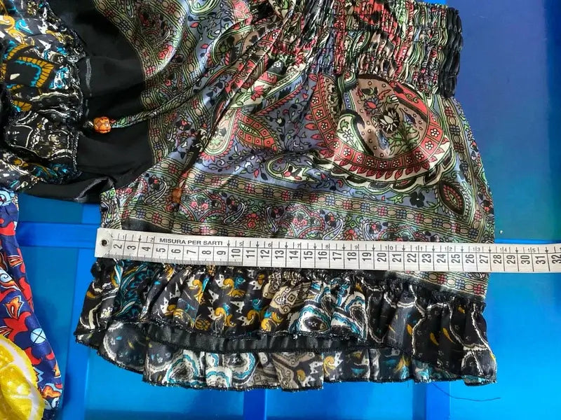 Close-up of a vibrant boho chic outfit featuring colorful patterns on a stylish bottom.